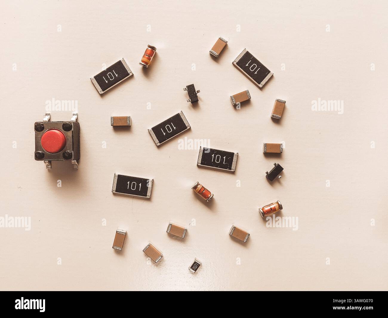 Surface-mount resistors, diodes and push button on white background Stock Photo