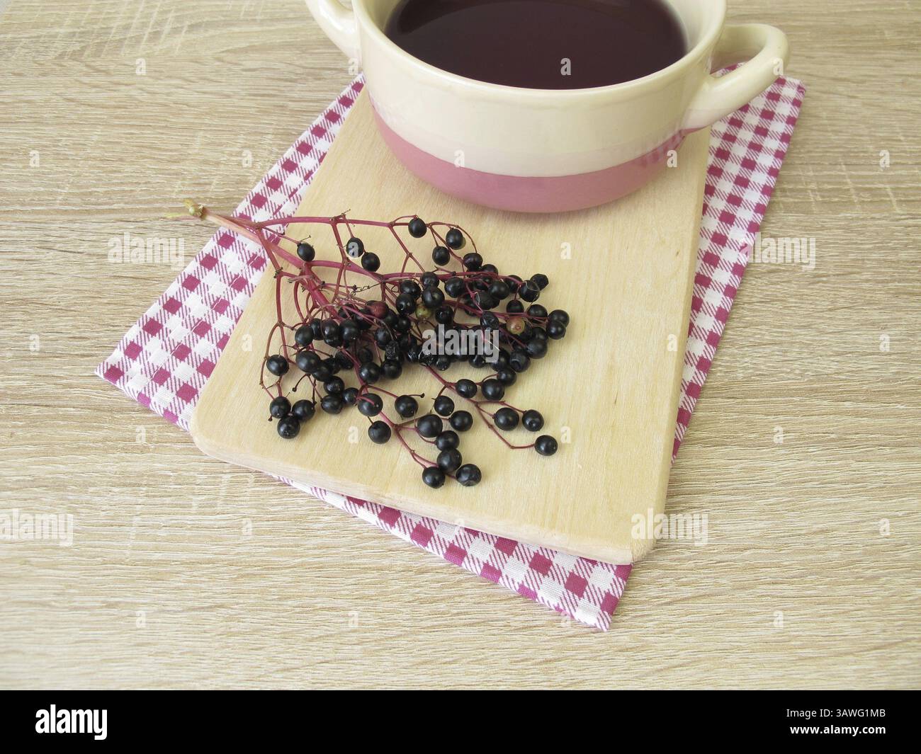 Dark purple dye bath, colouring agent made from elderberries Stock Photo