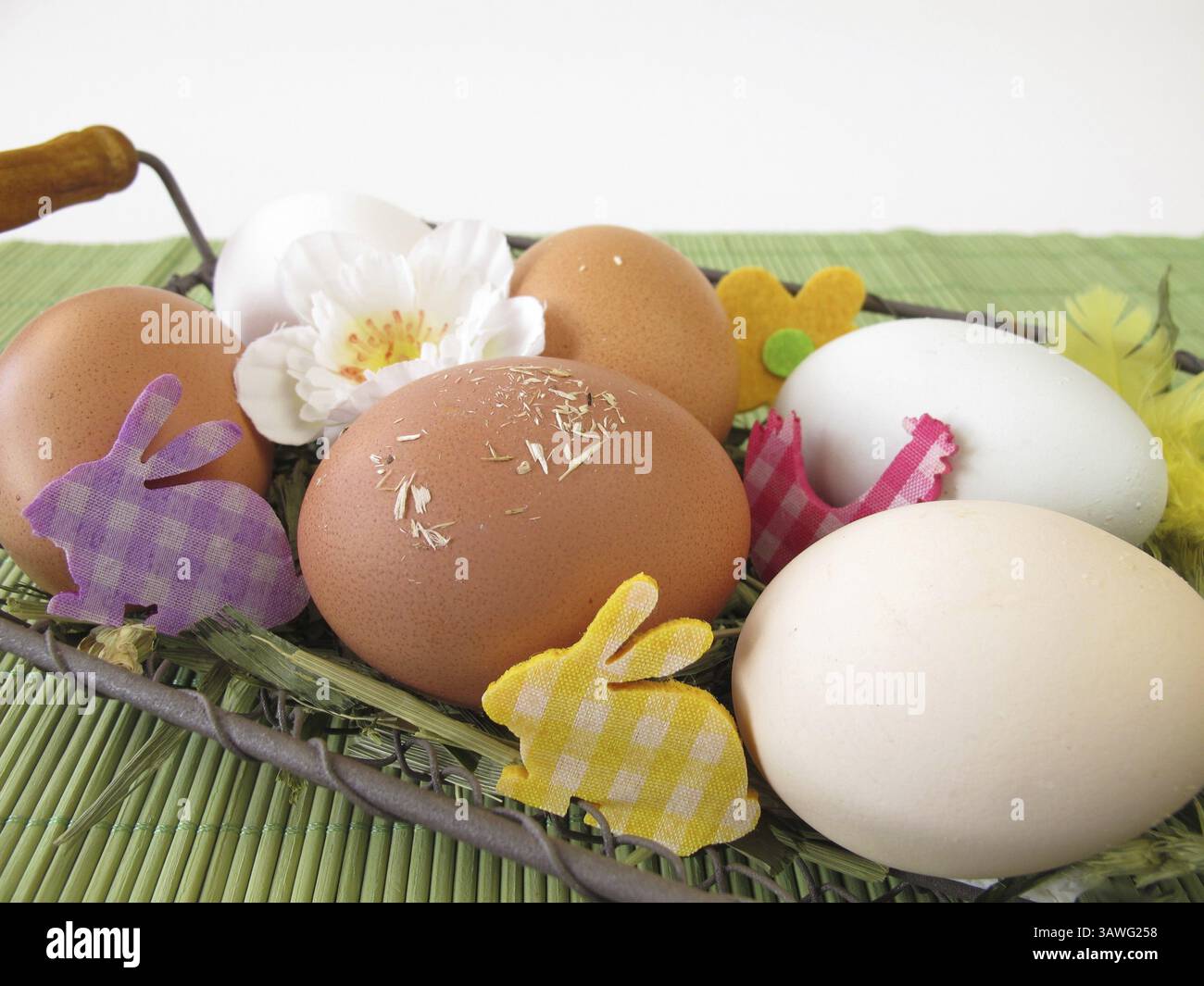 Naturally colourful eggs in the Easter basket Stock Photo