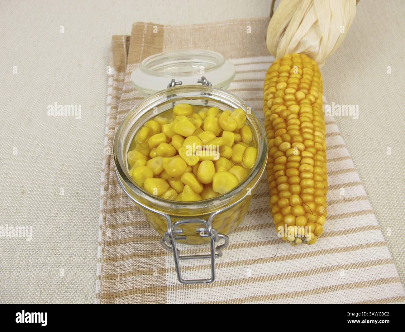 Cooked corn kernels in a jar Stock Photo