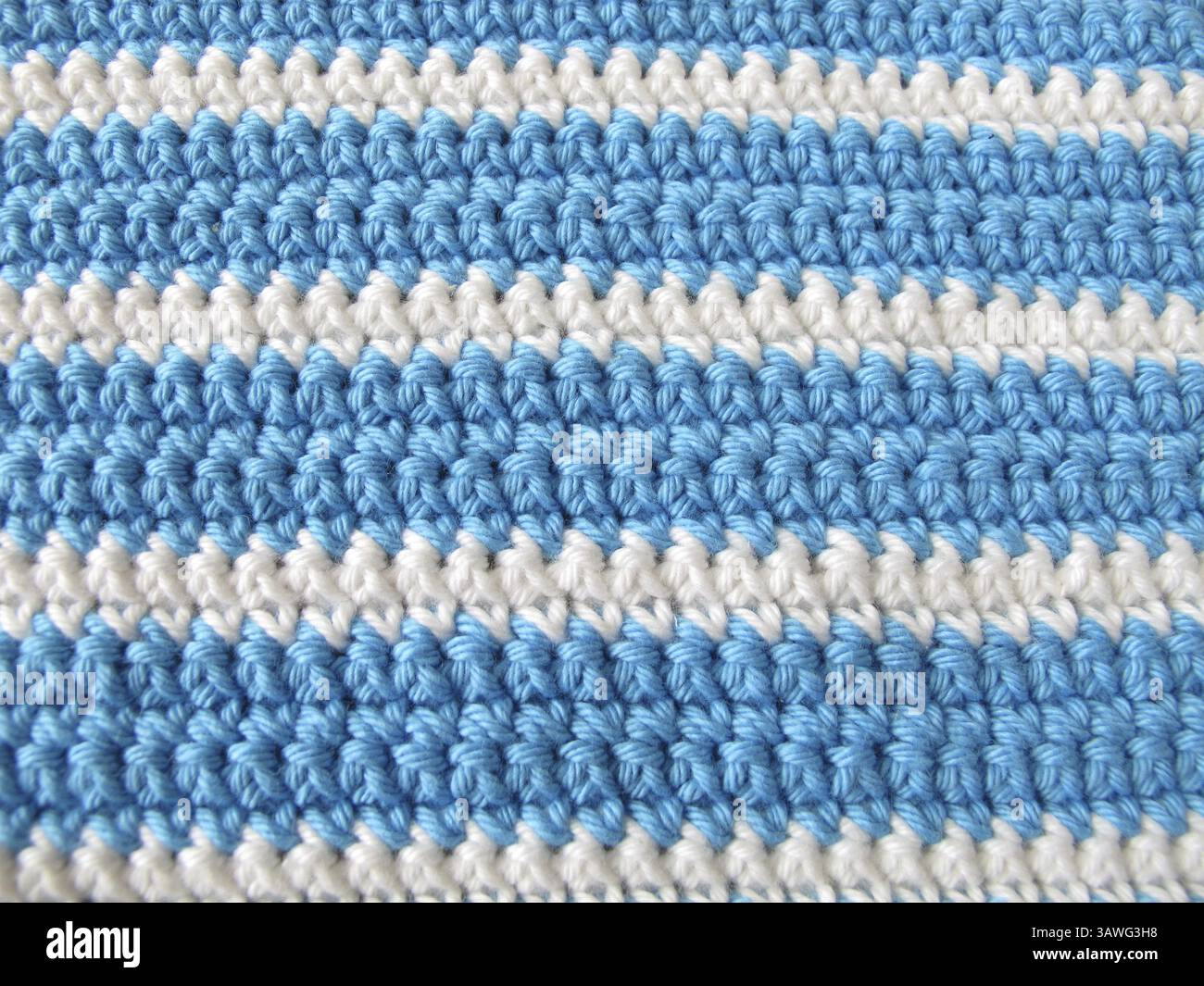 Crochet pattern background of single crochet stitches in white and blue ...