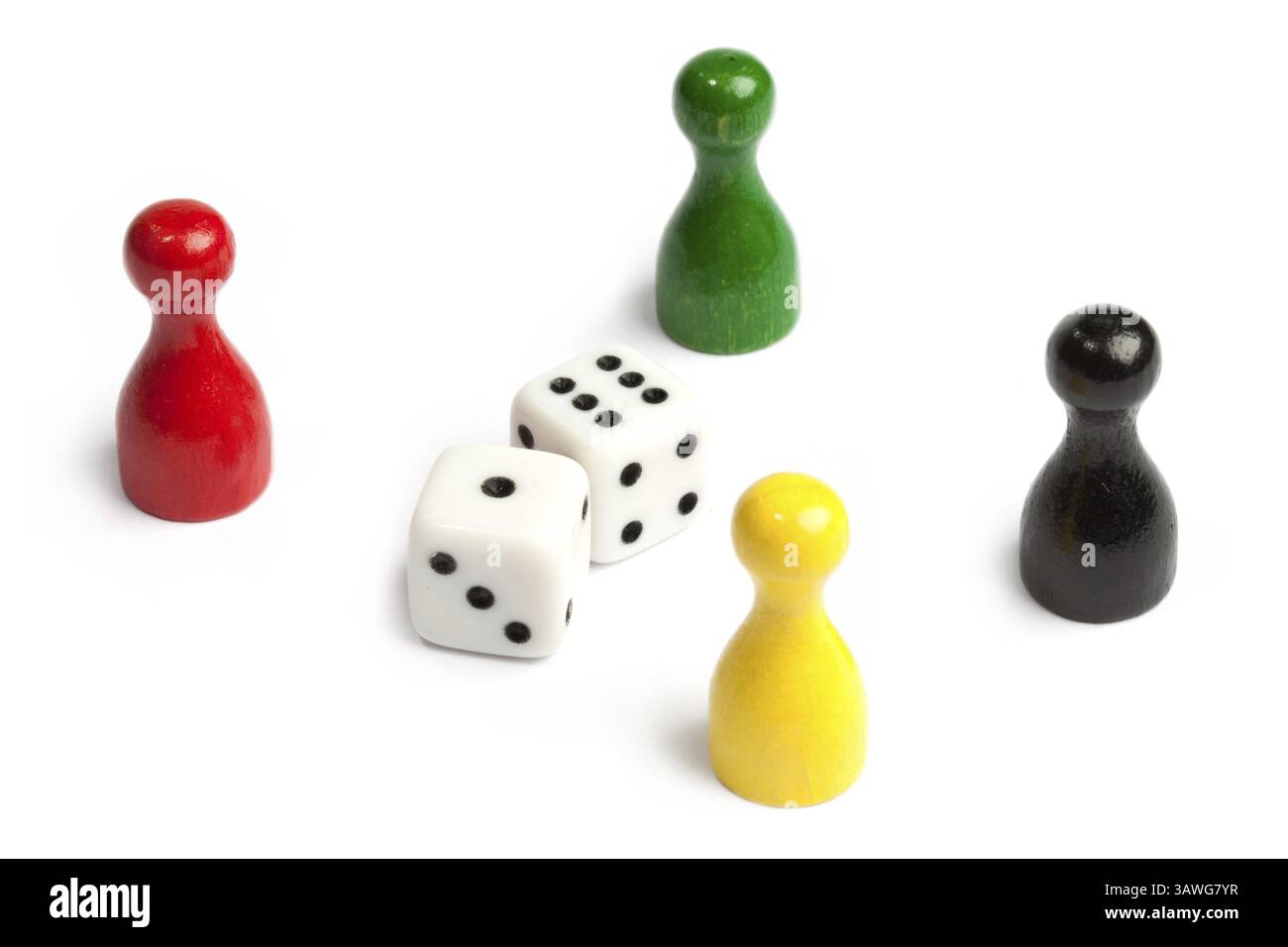 Four meeples in different colours standing around dice Four meeples in ...