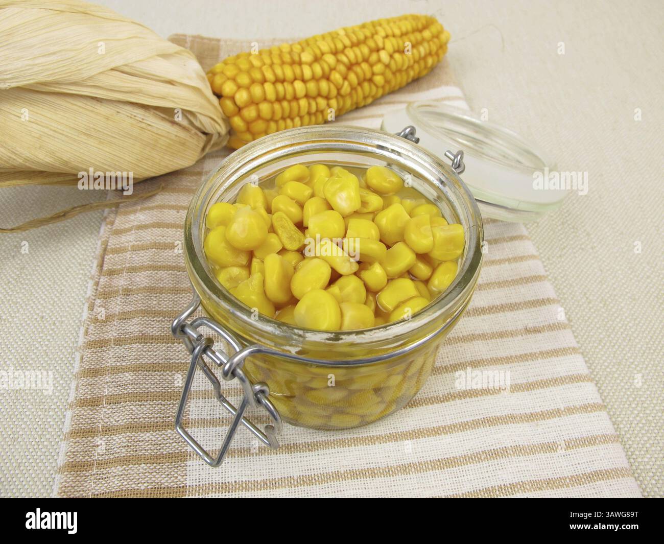 Cooked corn kernels in a jar Stock Photo