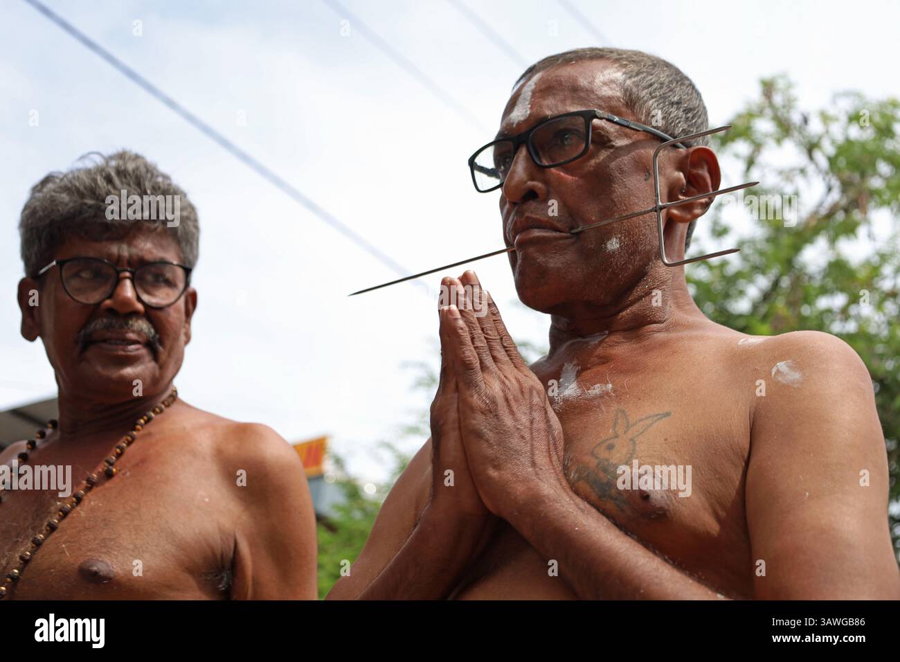 Banda Aceh, Aceh, Indonesia. 20th Apr, 2025. A Hindu devotee is seen with his mouth pierced with metal items during a procession during the Thaipusam series at the Shri Palani Andawer Temple, Banda Aceh City, Aceh province, Indonesia on Sunday, April 20, 2025.The annual Hindu Festival, mostly celebrated by the Tamil community in honour of The Hindu god Lord Murugan, remains in full swing in the Muslim-majority region with high tolerance. Credit: Khairu Syukrillah/ZUMA Press Wire/ZUMA Wire/Alamy Live News Stock Photo