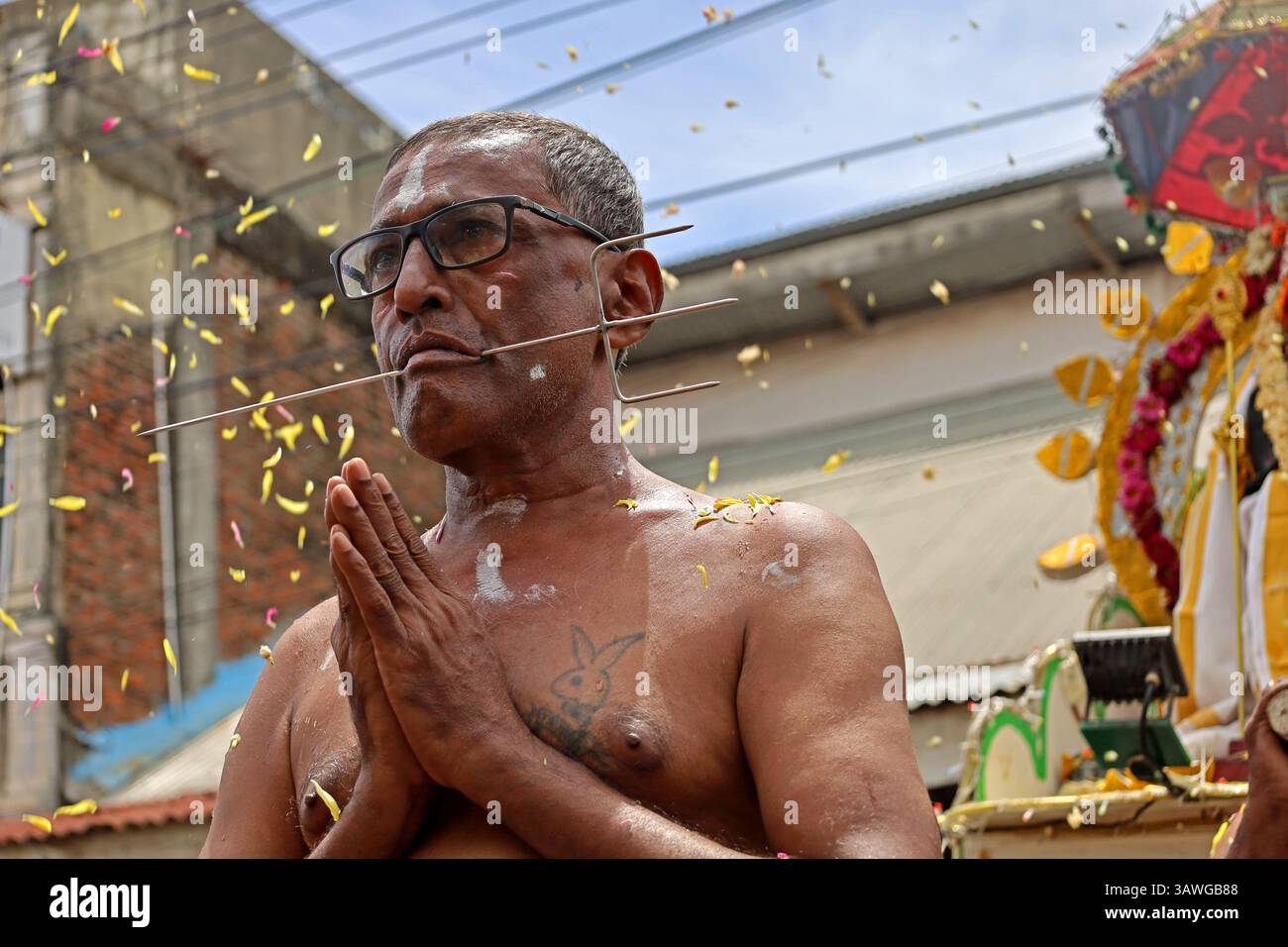 Banda Aceh, Aceh, Indonesia. 20th Apr, 2025. A Hindu devotee is seen with his mouth pierced with metal items during a procession during the Thaipusam series at the Shri Palani Andawer Temple, Banda Aceh City, Aceh province, Indonesia on Sunday, April 20, 2025.The annual Hindu Festival, mostly celebrated by the Tamil community in honour of The Hindu god Lord Murugan, remains in full swing in the Muslim-majority region with high tolerance. Credit: Khairu Syukrillah/ZUMA Press Wire/ZUMA Wire/Alamy Live News Stock Photo