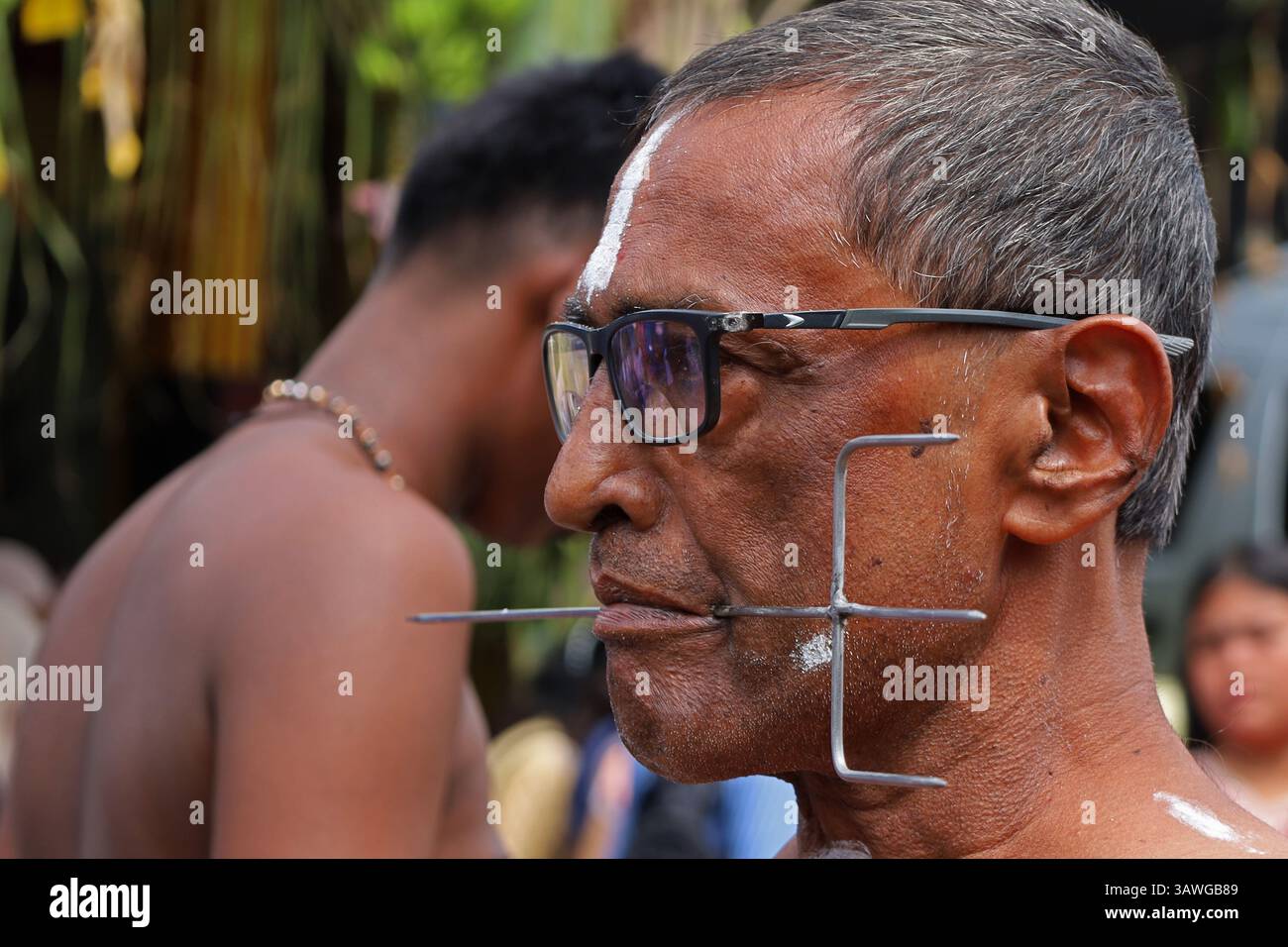 Banda Aceh, Aceh, Indonesia. 20th Apr, 2025. A Hindu devotee is seen with his mouth pierced with metal items during a procession during the Thaipusam series at the Shri Palani Andawer Temple, Banda Aceh City, Aceh province, Indonesia on Sunday, April 20, 2025.The annual Hindu Festival, mostly celebrated by the Tamil community in honour of The Hindu god Lord Murugan, remains in full swing in the Muslim-majority region with high tolerance. Credit: Khairu Syukrillah/ZUMA Press Wire/ZUMA Wire/Alamy Live News Stock Photo