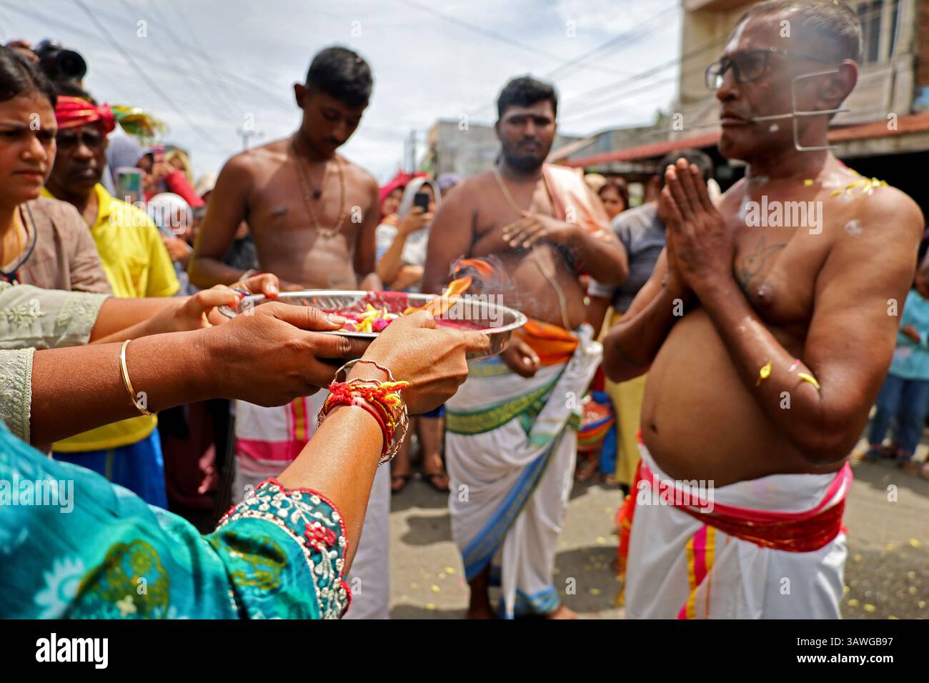 Banda Aceh, Aceh, Indonesia. 20th Apr, 2025. A Hindu devotee is seen with his mouth pierced by metal objects during a procession of offering prayers to gods in the series of Thaipusam at Shri Palani Andawer Temple, Banda Aceh City, Aceh province, Indonesia on Sunday, April 20, 2025. The annual Hindu Festival, mostly celebrated by the Tamil community in honour of The Hindu god Lord Murugan, remains in full swing in the Muslim-majority region with high tolerance. Credit: Khairu Syukrillah/ZUMA Press Wire/ZUMA Wire/Alamy Live News Stock Photo
