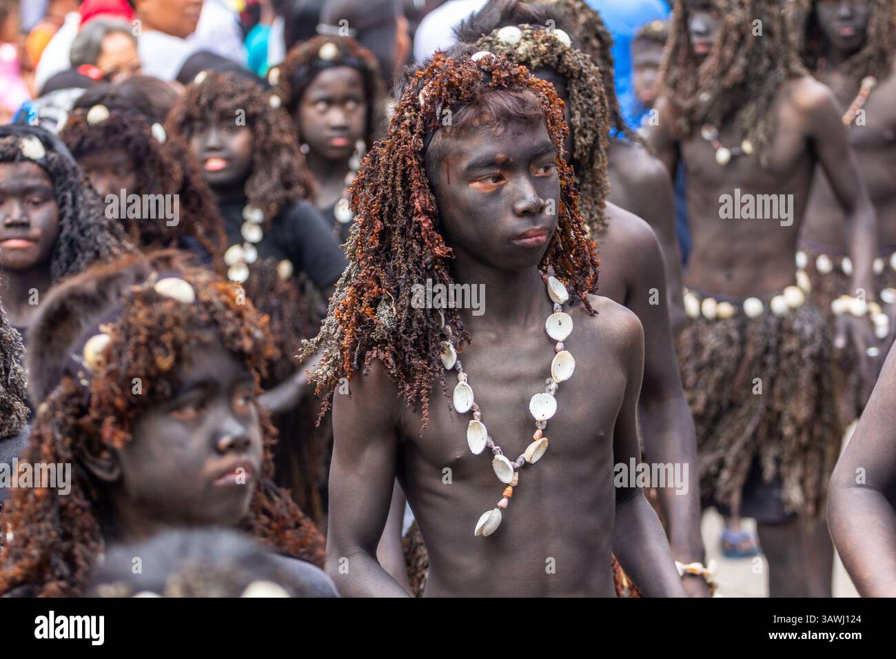 Young Ati-Ati Festival dancers painted black and wearing shell ornament ...