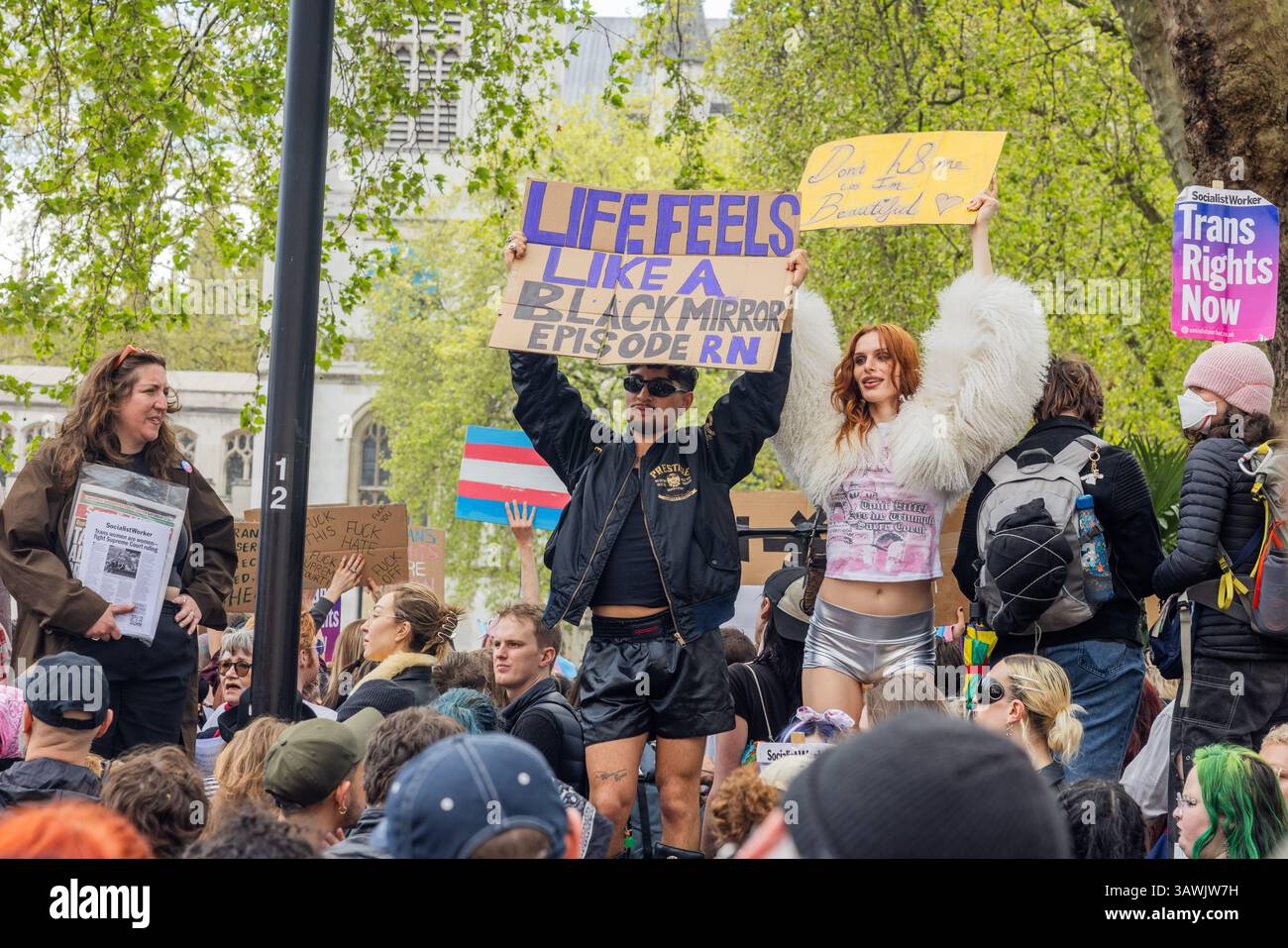 London, UK. 19 APR, 2025. People hold signs as thousands gathered at an ...