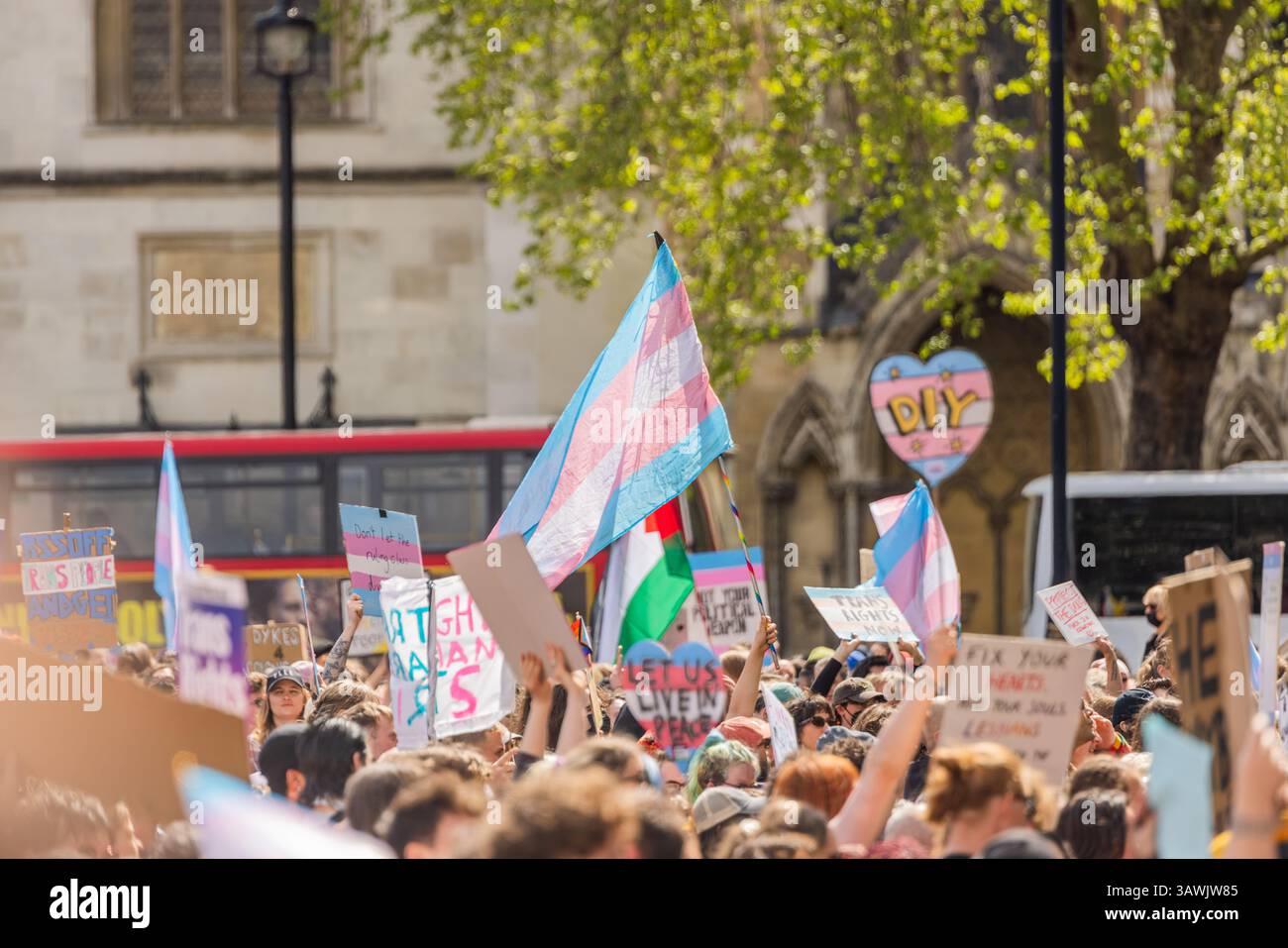 London, UK. 19 APR, 2025. Crowd hold signs and flags as thousands ...
