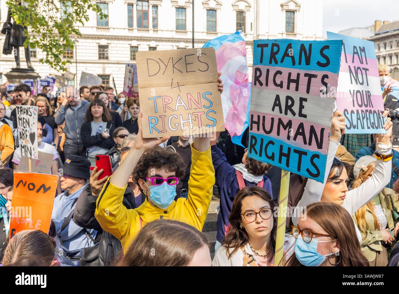 London, UK. 19 APR, 2025. People hold signs as thousands gathered at an ...