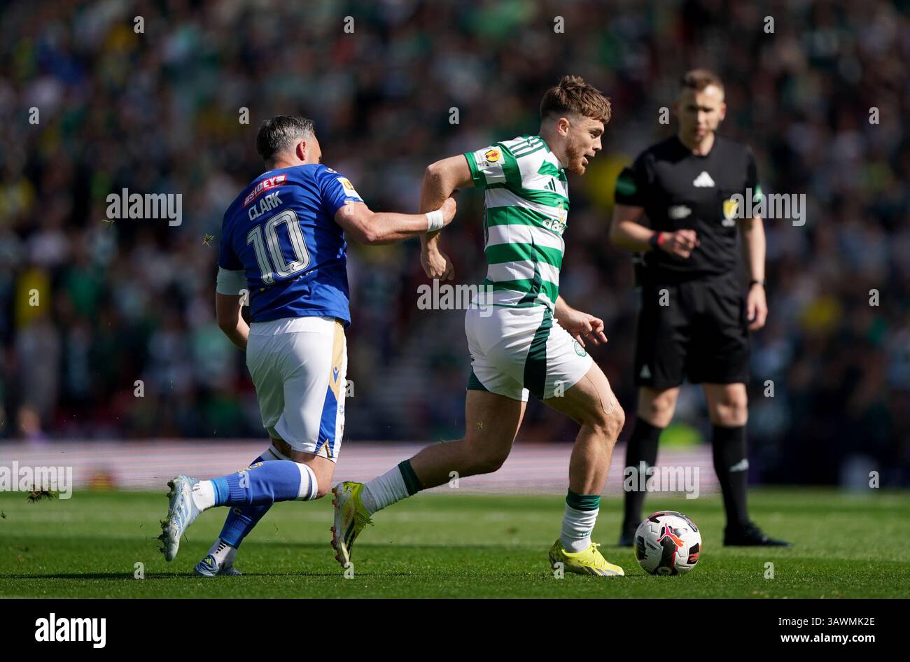 St Johnstone's Nicky Clark (left) and Celtic's James Forrest battle for ...