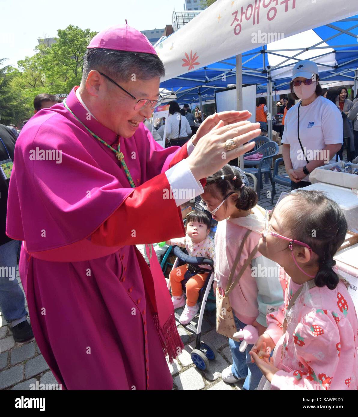Easter Mass in South Korea Archbishop Chung Son-taek L gives communion ...