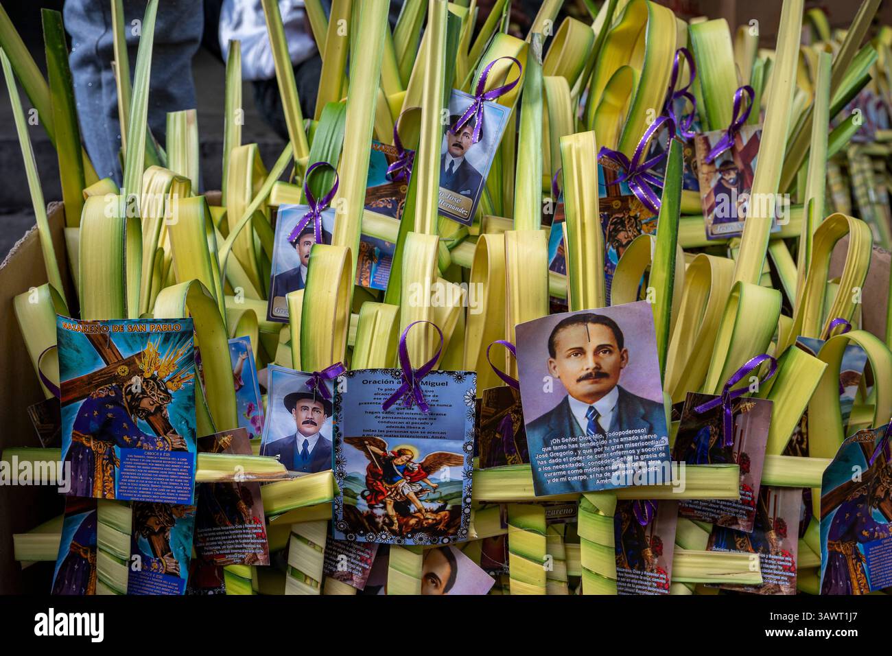 Palm Sunday palms are offered for sale with images of the Nazarene and ...