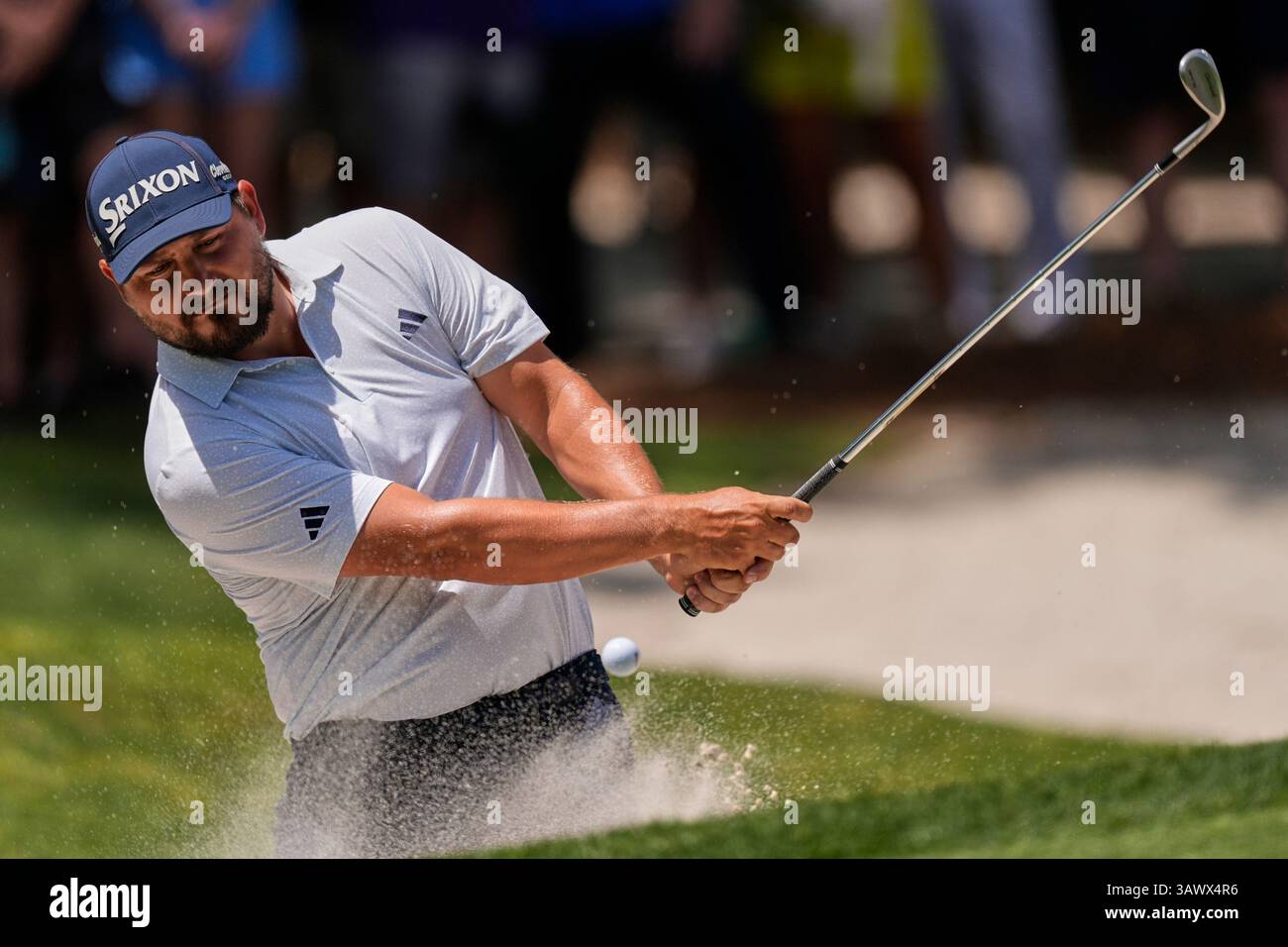 Andrew Novak hits from the bunker on the second hole during the final ...