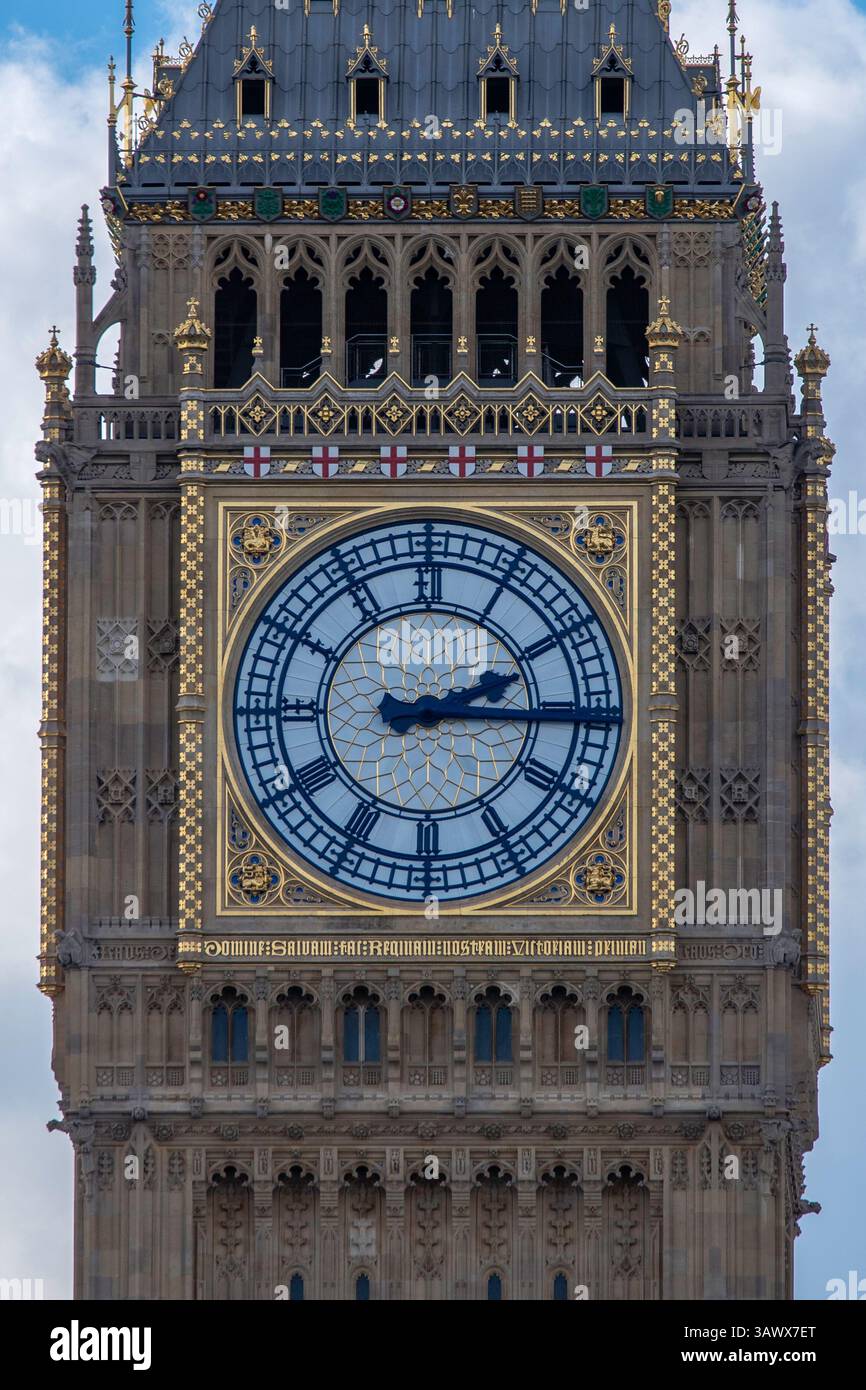 Close-up of Big Ben in London on a partly cloudy day. The iconic clock ...