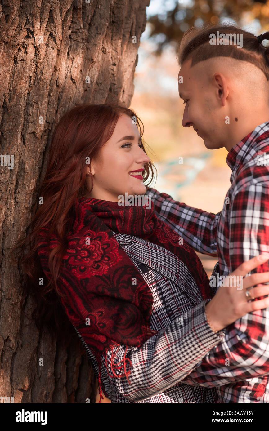young couple in love walking and having fun in autumn park Stock Photo