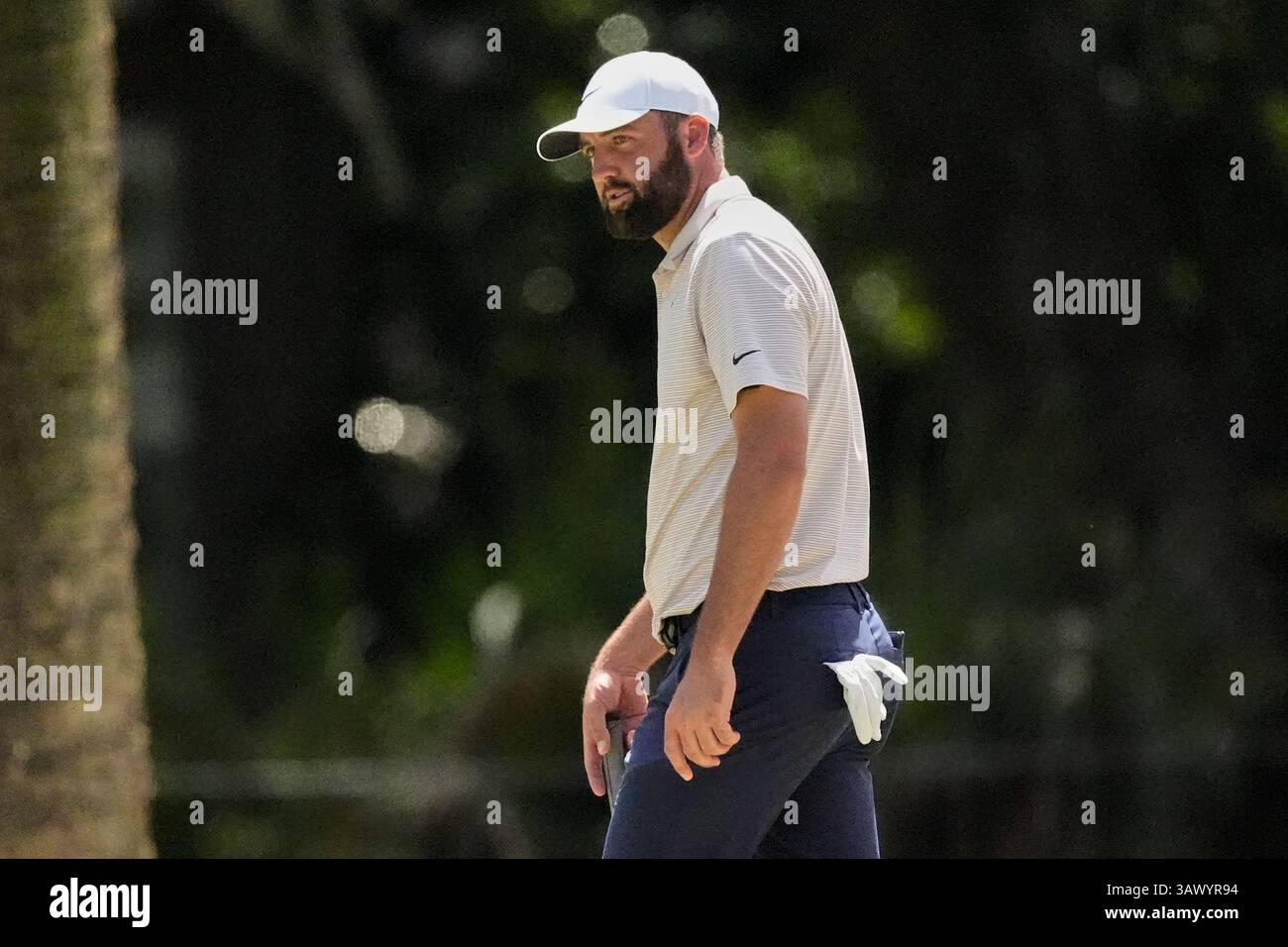 Scottie Scheffler watches his putt on the seventh hole during the final