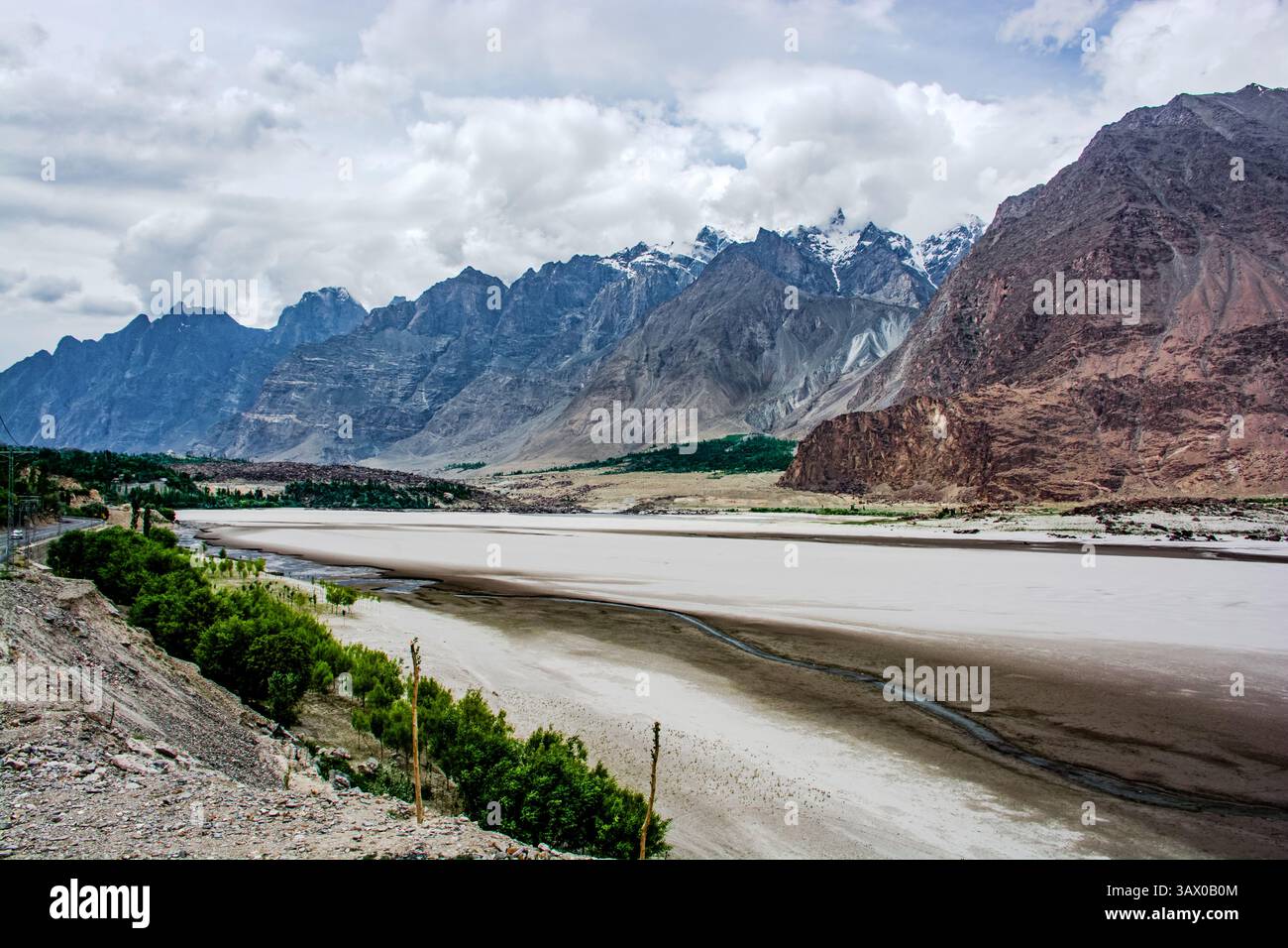 The Passu Cones, or Cathedral Peak a 6,106 m, alongside the Hunza River and Karakoram highway Stock Photo
