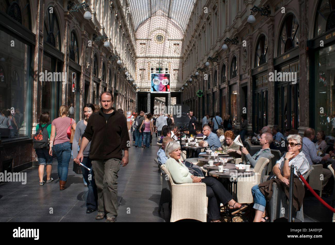 Sep 11, 2015 - Brussels, Belgium - Restaurants at Galeries St Hubert shopping arcade in the city centre, Brussels, Belgium. Galeries St-Hubert. Cafeterias at the Galeries St-Hubert. Rue des Bouchers.  Gare Centrale. Inaugurated by King Leopold I of Belgium in 1847, it was one of the first covered shopping arcades in Europe, and the first building in Brussels hosted a glass roof and metal. It was made by Jean-Pierre Cluysenaar in neo-Renaissance style and inside cohabit for more than century and a half ago a good selection of the best shops in town luxury ornate and decorated with great care. I Stock Photo