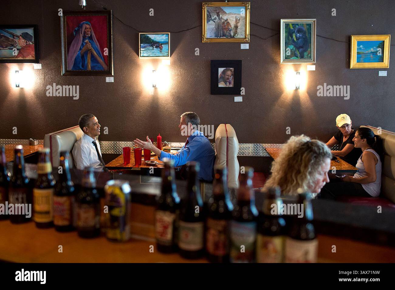 June 10, 2014 - Alexanderia, VA, United States of America - US President Barack Obama and Education Secretary Arne Duncan have lunch together at FireFlies restaurant June 10, 2014 in Alexandria, Virginia.  Barack Hussein Obama II (born August 4, 1961) is the 44th President of the United States. He is the first African American to be elected to office and the first president born outside the contiguous United States. Born in Honolulu, Hawaii, Obama is a graduate of Columbia University and Harvard Law School. He worked as a civil rights attorney and taught constitutional law at the University of Stock Photo