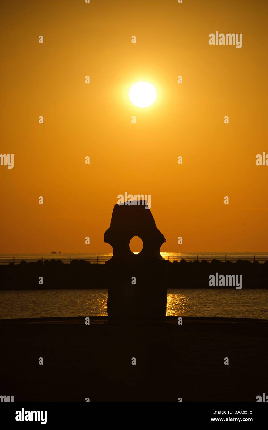 Photo shows the sun setting at Futami Seaside Park in Iyo on the Seto Inland Sea coast in Ehime Prefecture, Japan  Oct. 2014. The area is not only fam Stock Photo