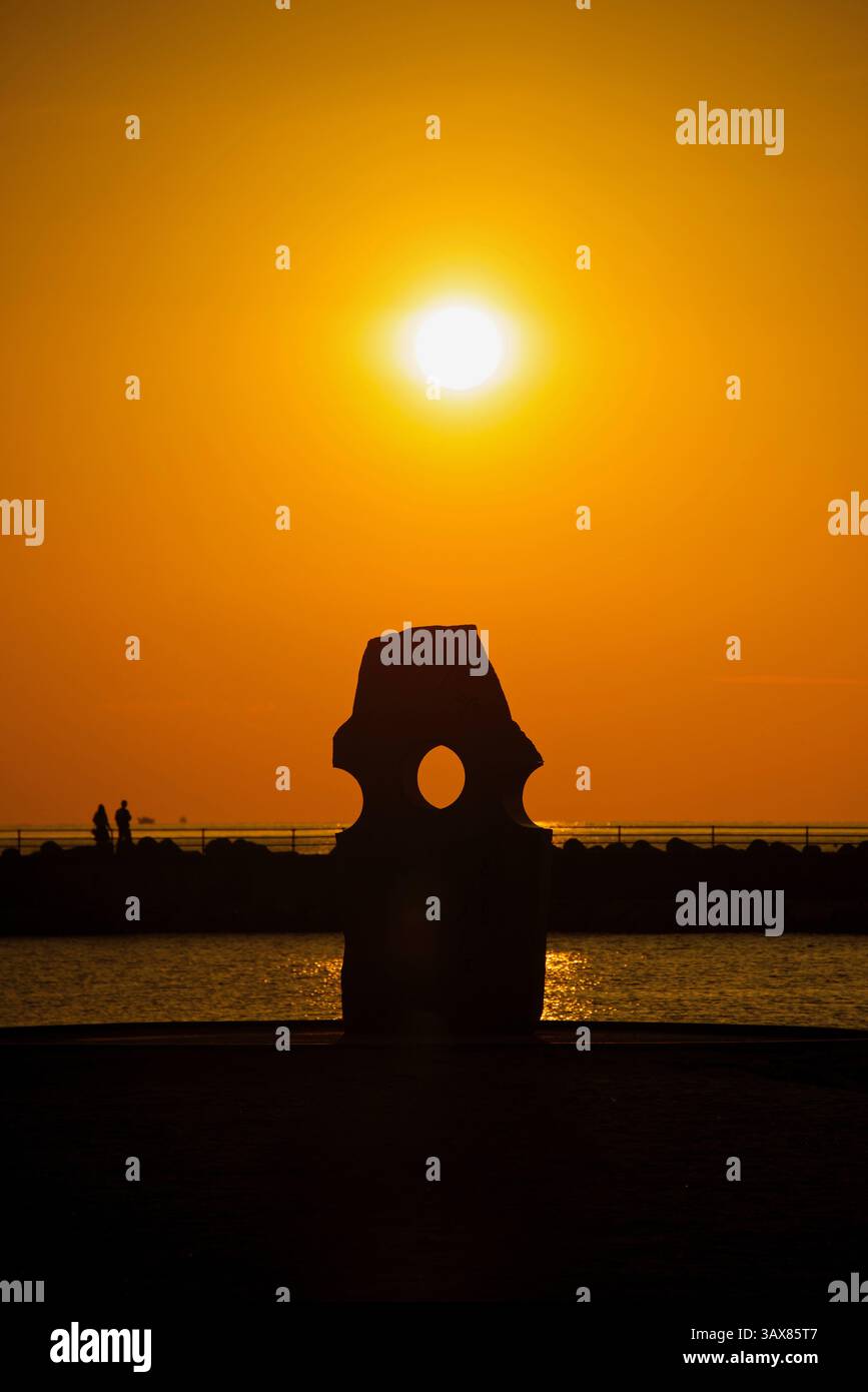 Photo shows the sun setting at Futami Seaside Park in Iyo on the Seto Inland Sea coast in Ehime Prefecture, Japan  Oct. 2014. The area is not only fam Stock Photo