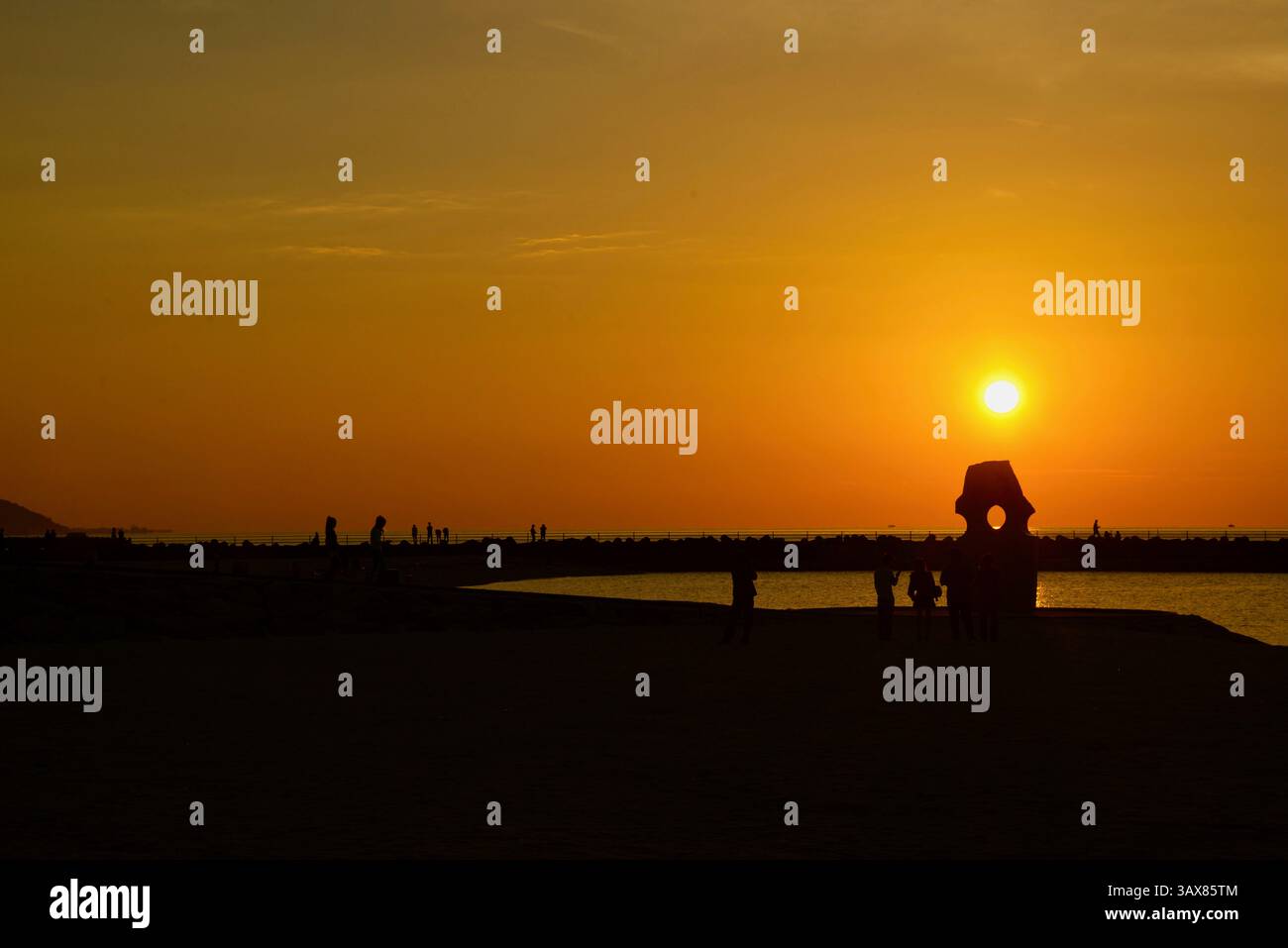Photo shows the sun setting at Futami Seaside Park in Iyo on the Seto Inland Sea coast in Ehime Prefecture, Japan  Oct. 2014. The area is not only fam Stock Photo