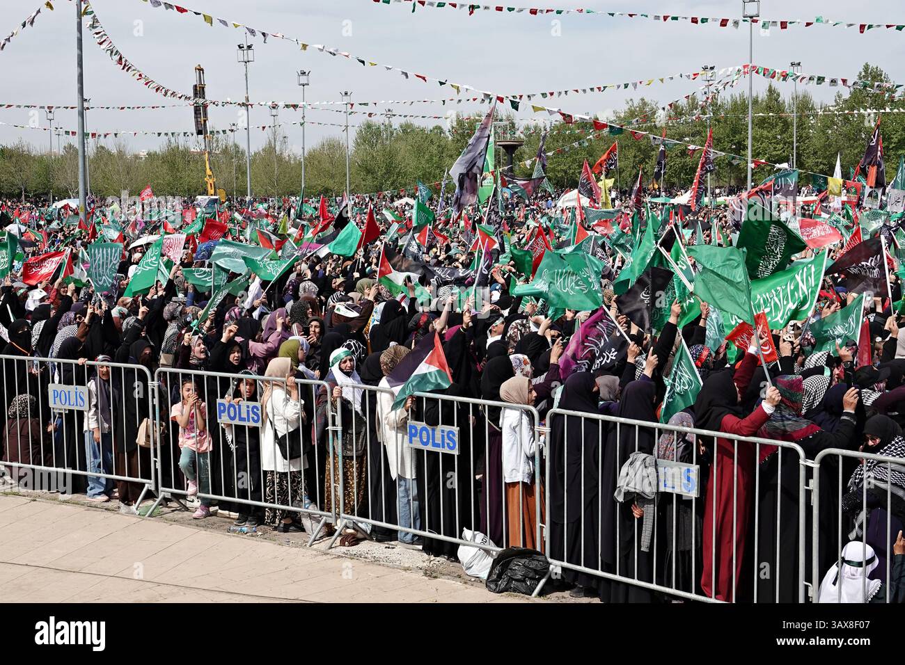 Tens of thousands of women are seen attending the event in Diyarbakir ...