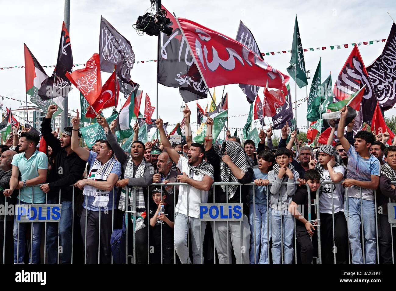 Participants of the celebration in Diyarbakir are seen carrying ...