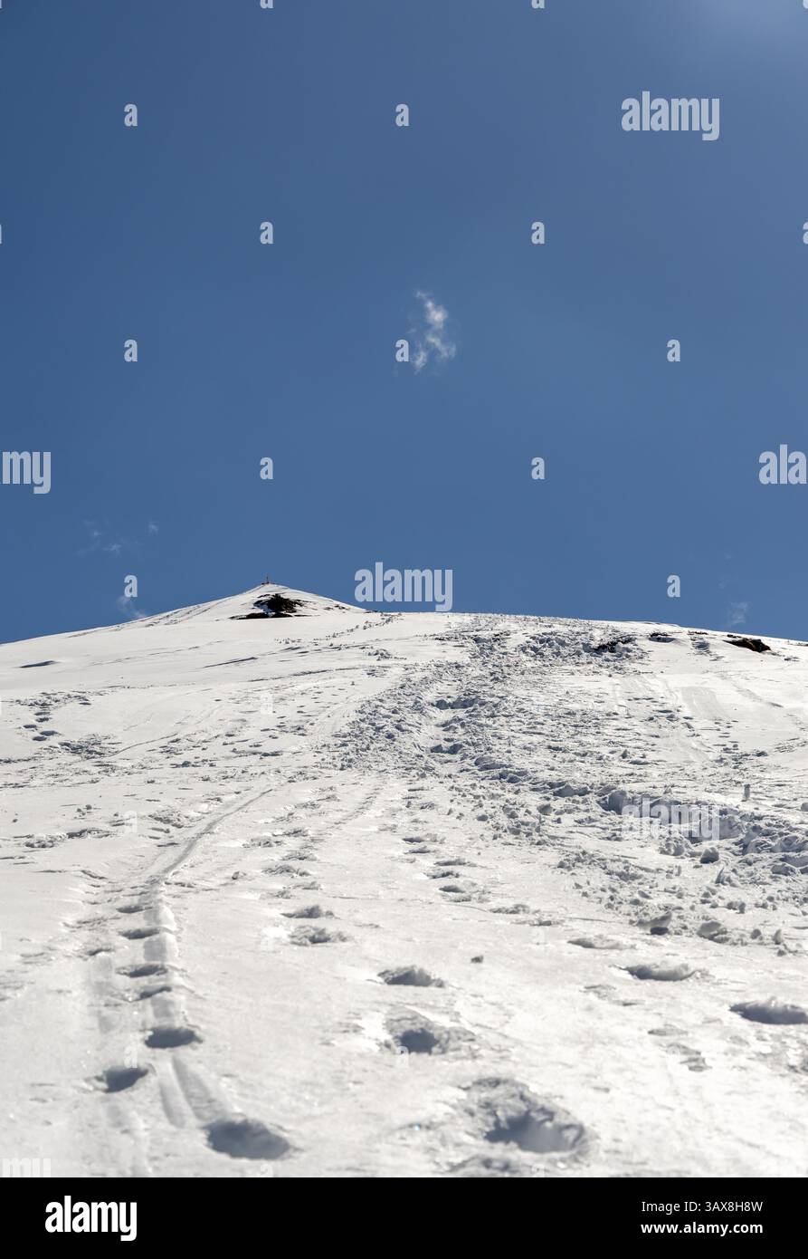Snowy Trails Leading To Snowcap Mountain Summit With Bright Blue Photo Inspiration