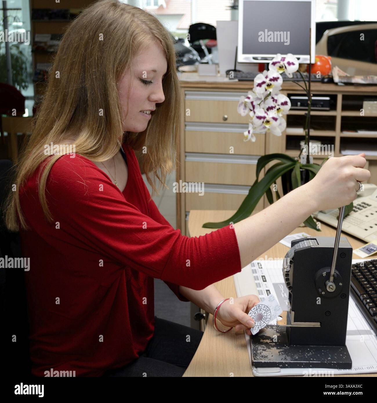 Woman prepares inspection sticker Stock Photo - Alamy