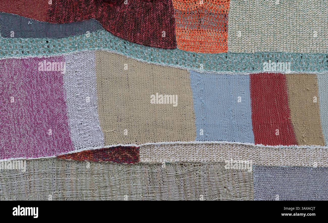 Knitted mosaic makes a colourful patchwork quilt Stock Photo