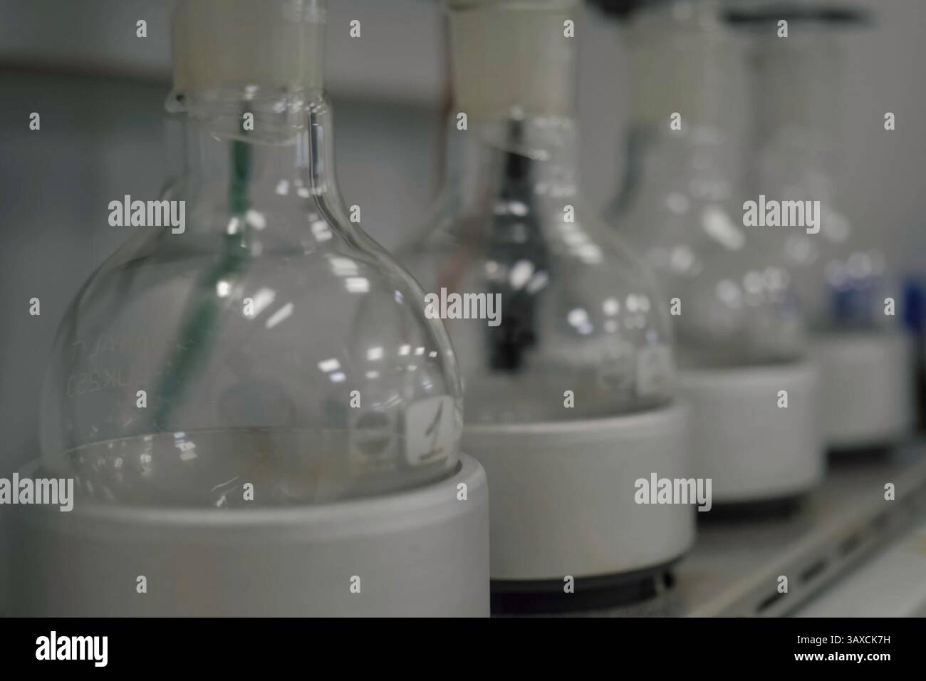 Glass flasks in the laboratory. Chemical Analyses Stock Photo