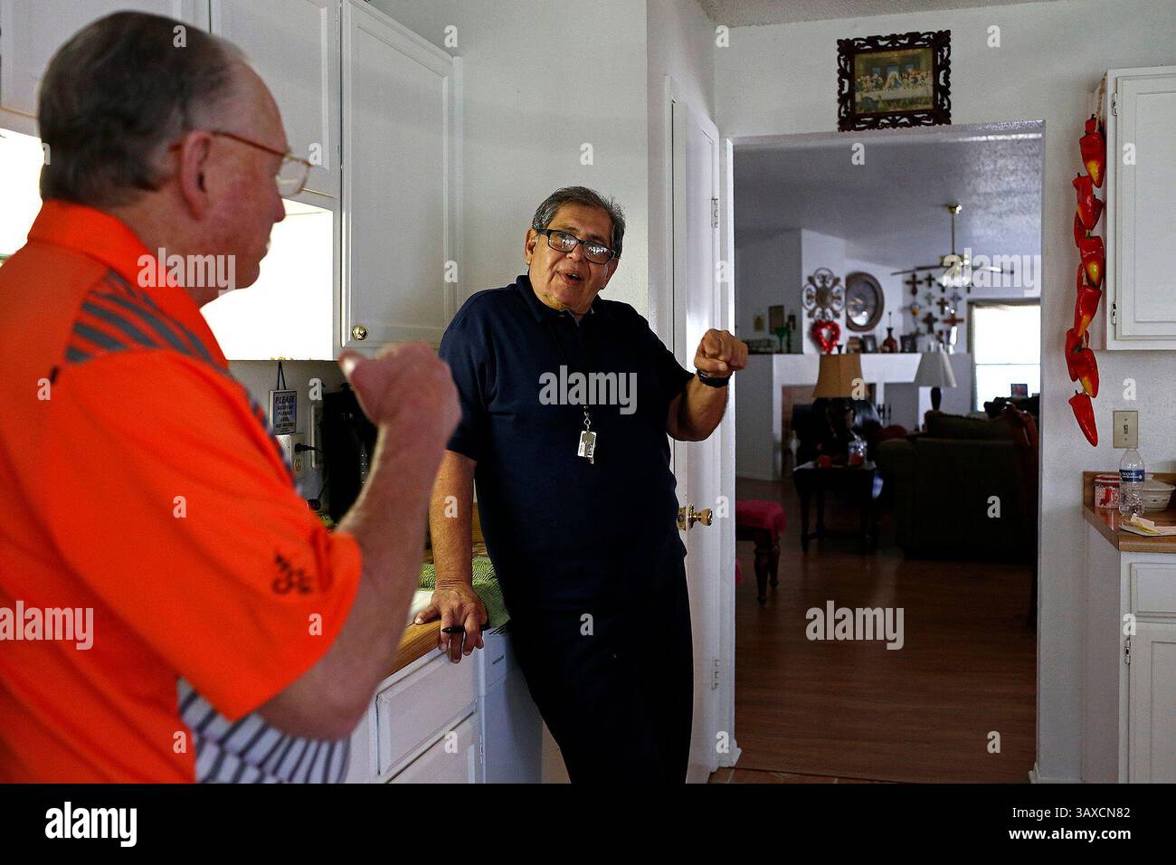 January 29, 2016 - San Antonio, TX, USA - Robert Gill talks with his brother-in-law, Andy Walker, left,  at Walker's home in San Antonio on Friday, Jan. 29, 2016. Gill is a nonviolent drug offender who spent 25 years in prison until last summer, when President Obama commuted his life sentence. (Credit Image: © San Antonio Express-News via ZUMA Wire) Stock Photo