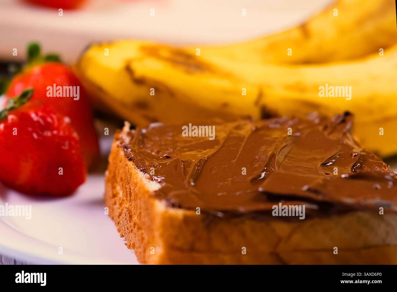 Chocolate spread spread on bread. Morning breakfast Stock Photo