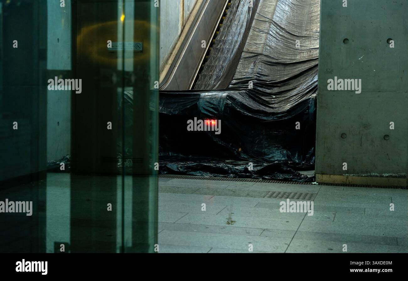 Budapest, Hungary - November 2, 2024: Escalator Under Repair – A halted escalator at Kelenföld station, cordoned off with maintenance barriers Stock Photo