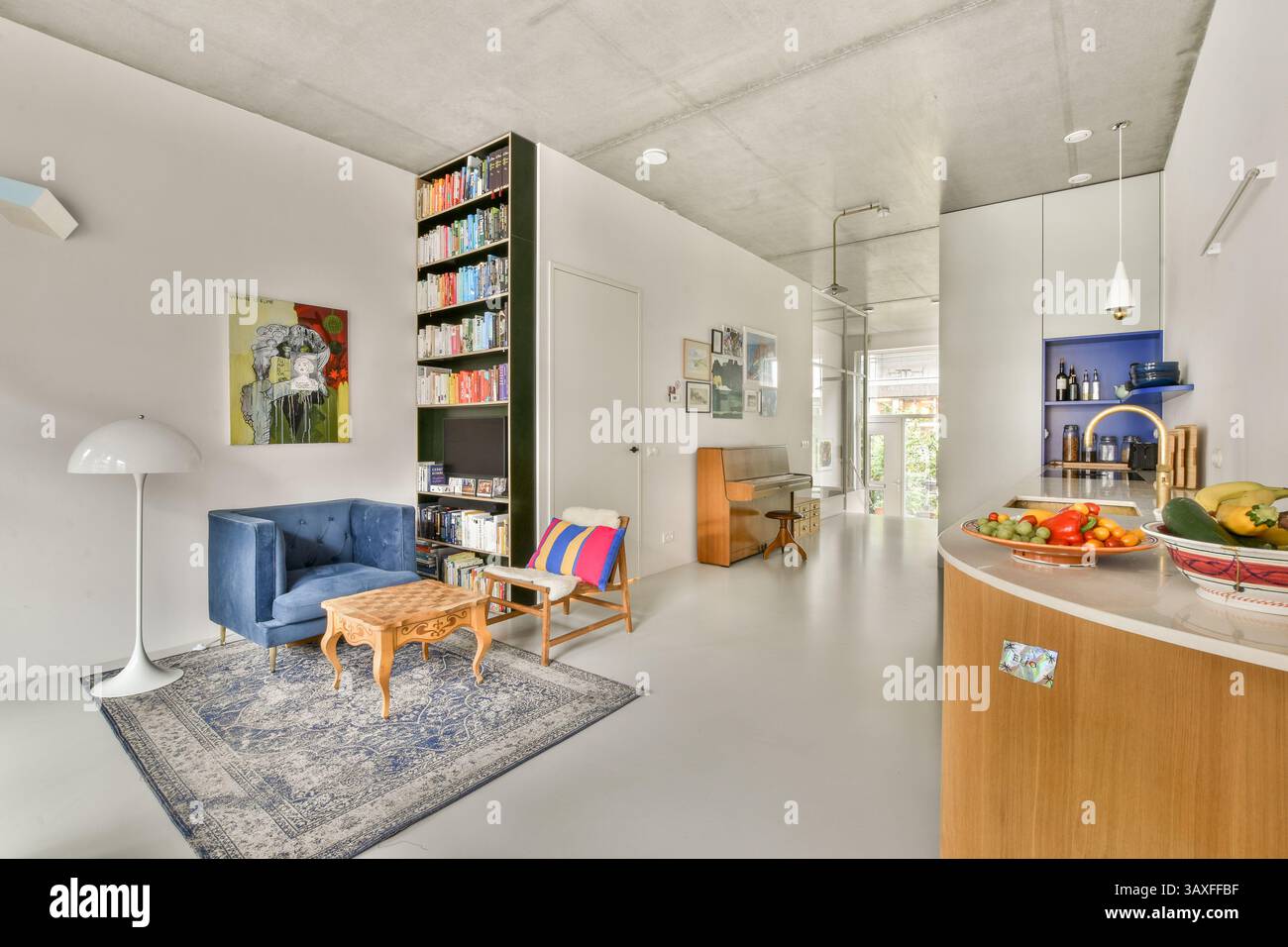 A stylish modern interior showcasing a cozy seating area, bookshelves ...