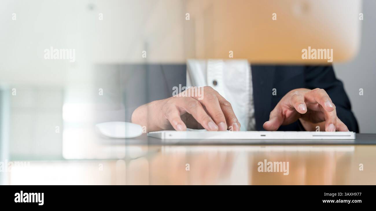 Indian Using Keyboard Closeup of Indian businessman typing on keyboard and scrolling mouse at ...