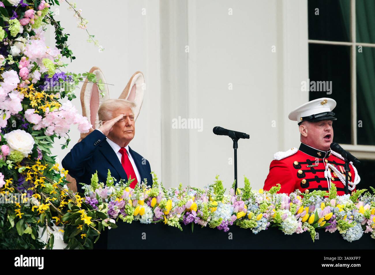 President Donald Trump salutes as he is joined by a person in an Easter ...