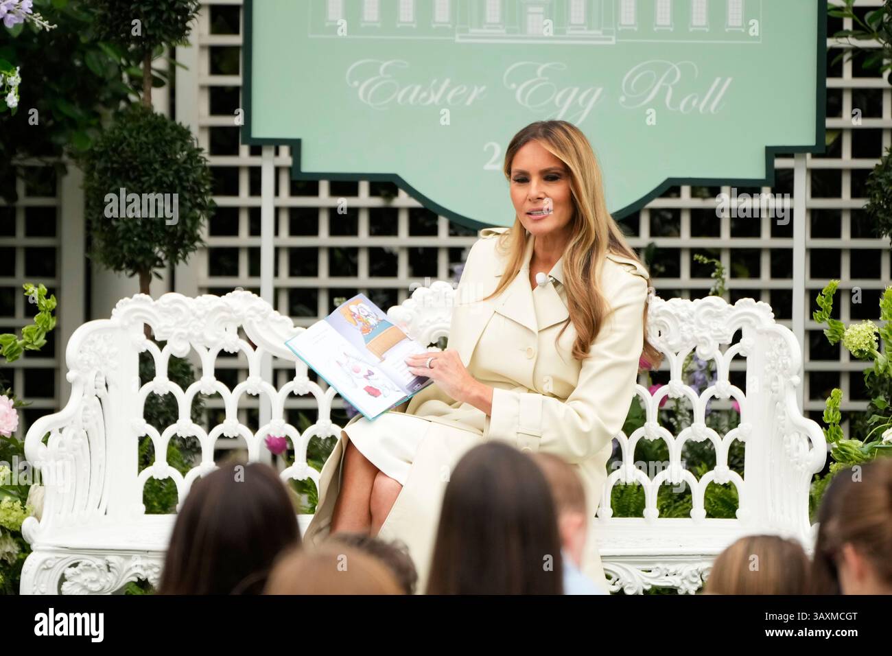 First lady Melania Trump reads a book to children during the White