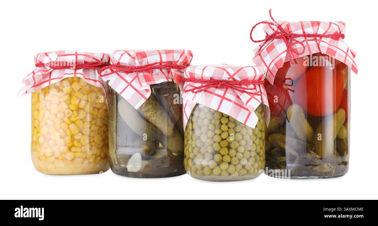 Many jars with different pickled products isolated on white Stock Photo