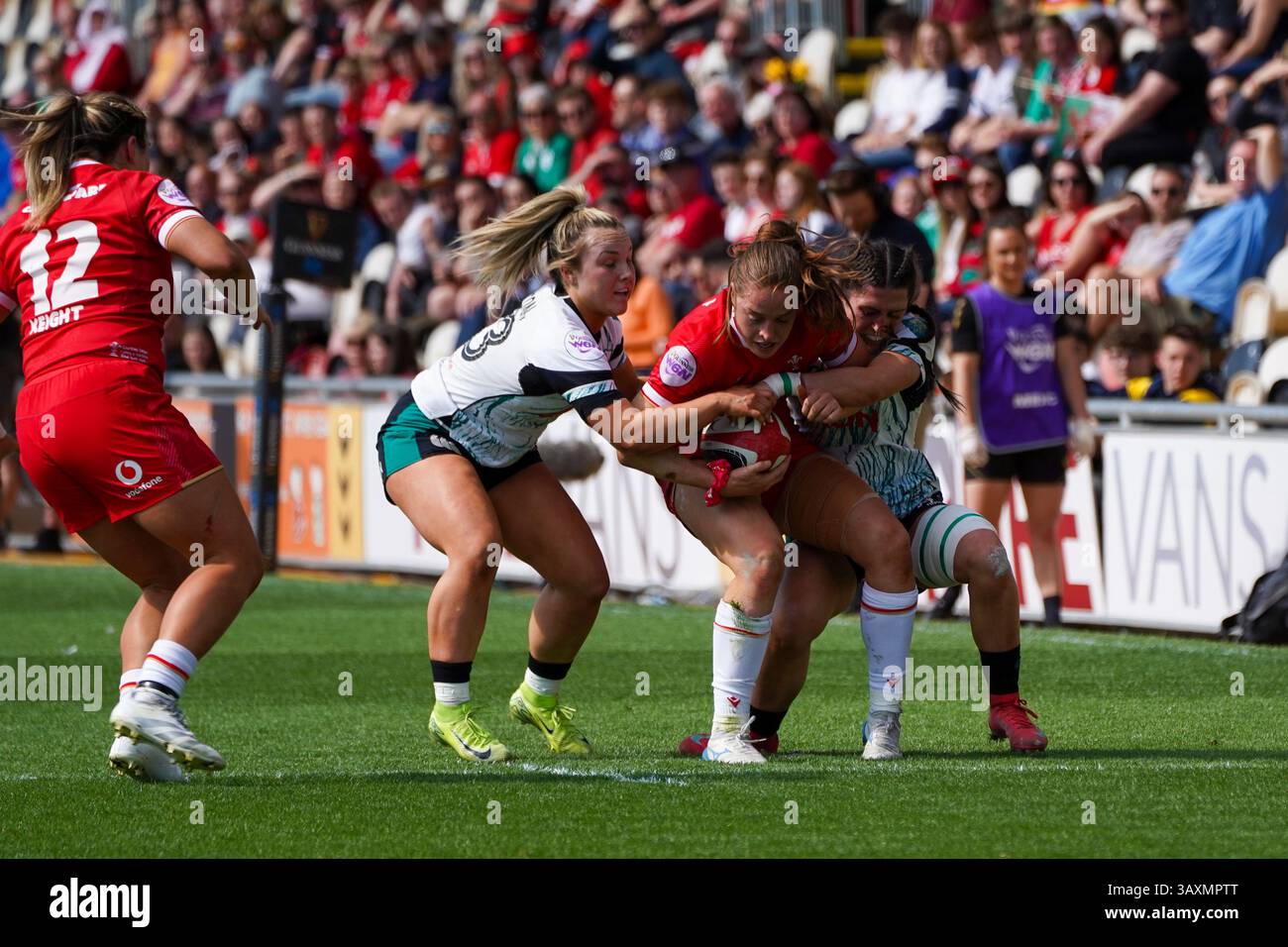 Lisa Neumann (Wales) tackled by Aoife Dalton (L) and Amee-Leigh Costigan (right), Women's six nations, 20th Apr 2025 Stock Photo