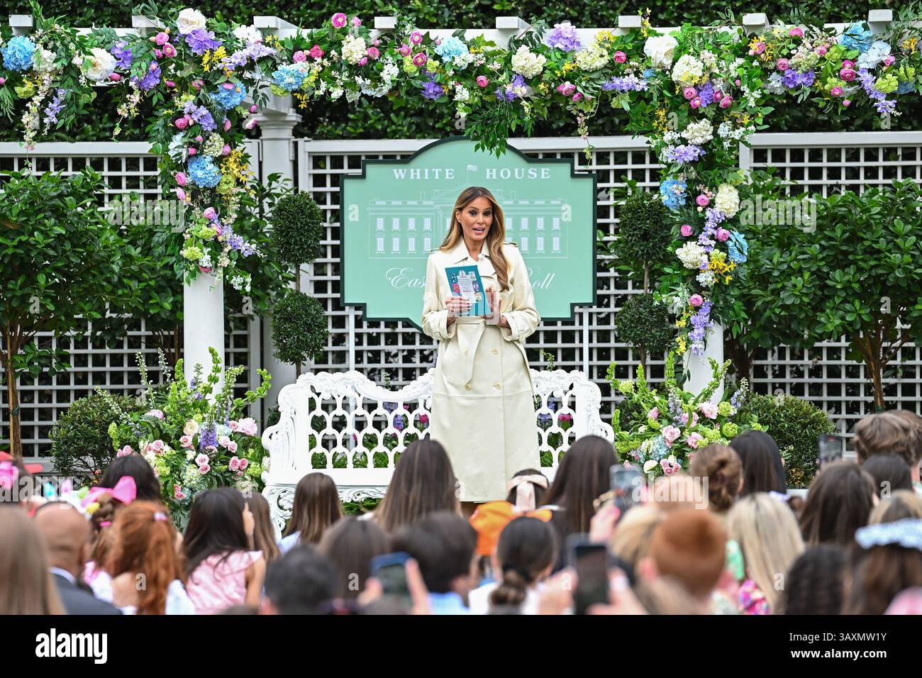 First Lady Melania Trump reads a book to children during the White