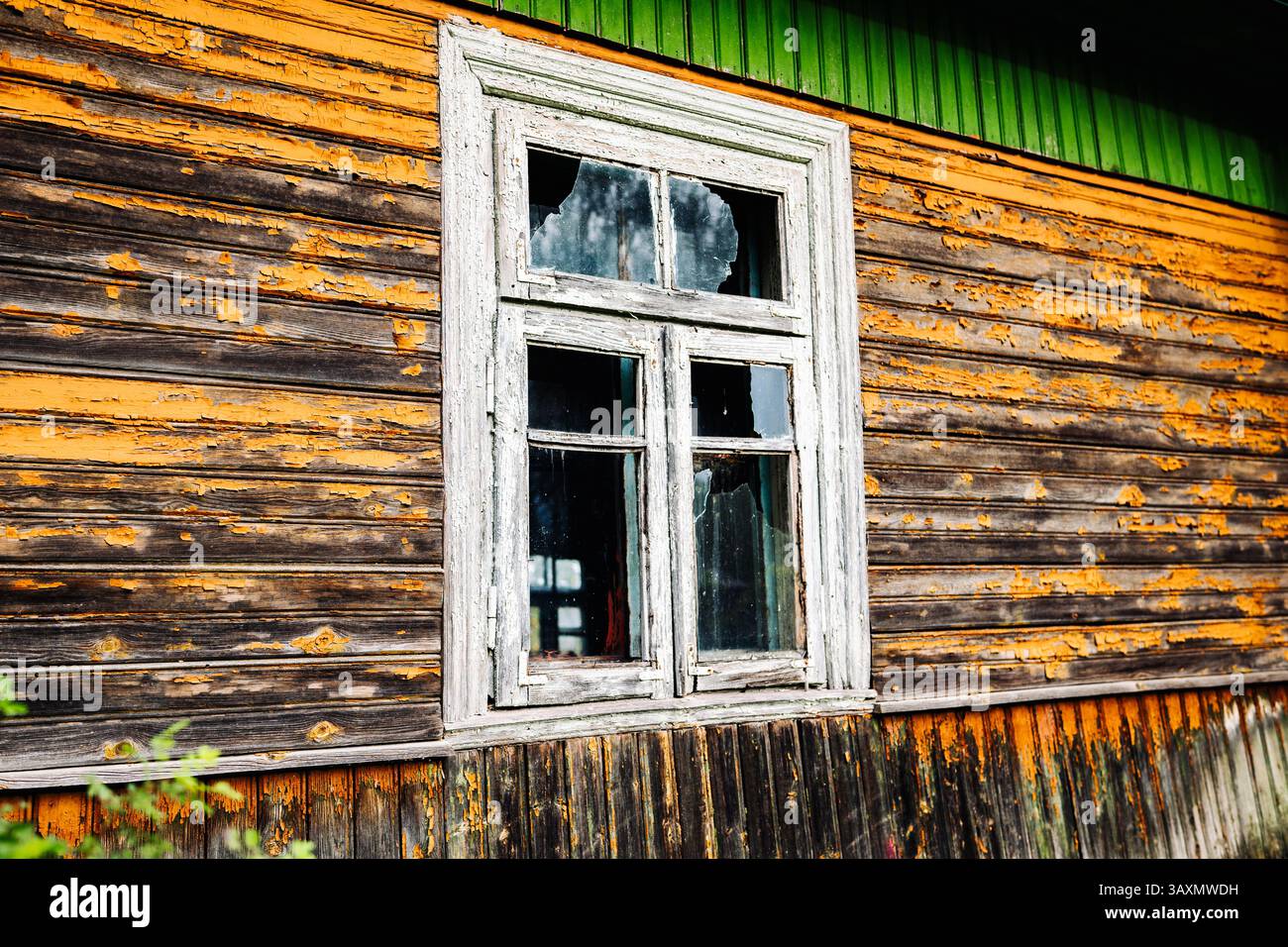 Broken window in old abandoned wooden house with peeling paint Stock ...