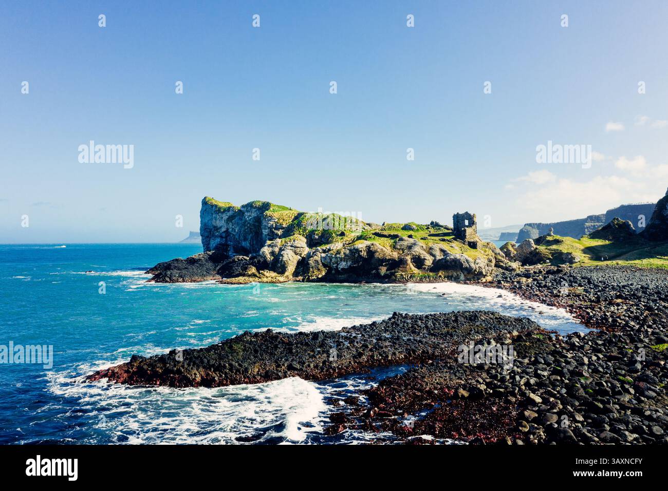 Aerial View Of Kinbane Castle Ruins On A Clear Sunny Day With Coastal 