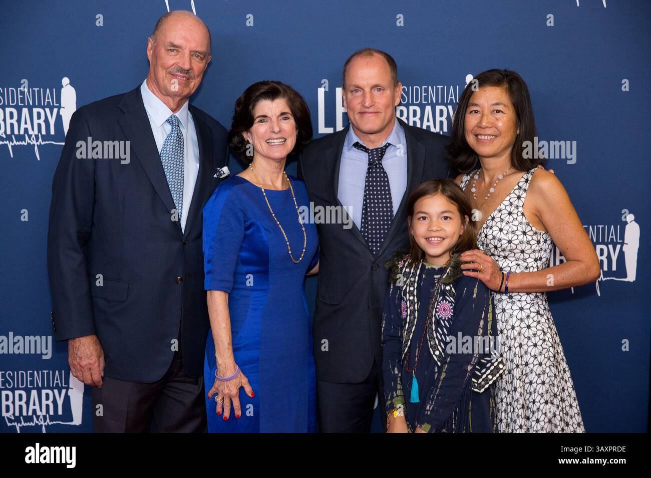October 22, 2016 - Austin, Texas, U.S. - Former U.S. President Lyndon B. Johnsons daughter Luci Baines Johnson (second from left) and husband Ian J. Turpin (left) pose with actor Woody Harrleson, wife Laura Louie, and daughter Makani Harrelson on the red carpet before a screening of the new Rob Reiner film LBJ at the LBJ Presidential Library October 22, 2016 in Austin, Texas. . (Credit Image: © Gabriel Cristover Perez/Planet Pix via ZUMA Wire) Stock Photo