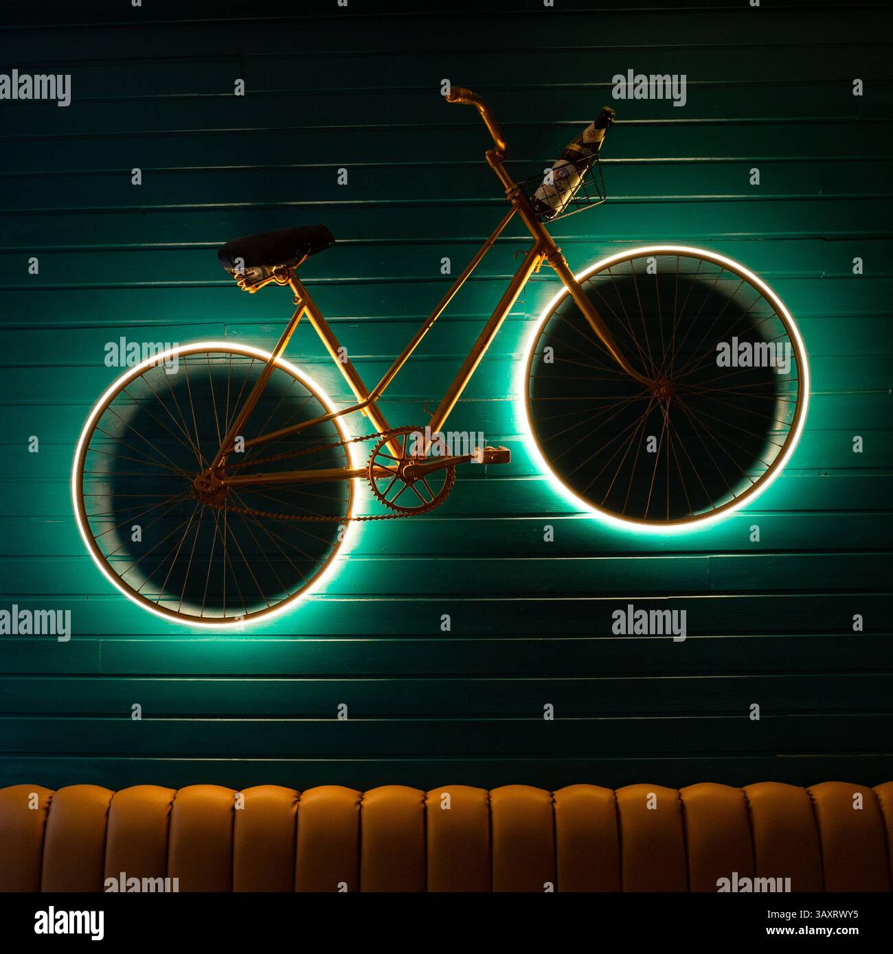 26 March 2025, a classic bicycle with a Erdinger Beer in a Pub wall, Guimaraes, Portugal. Stock Photo