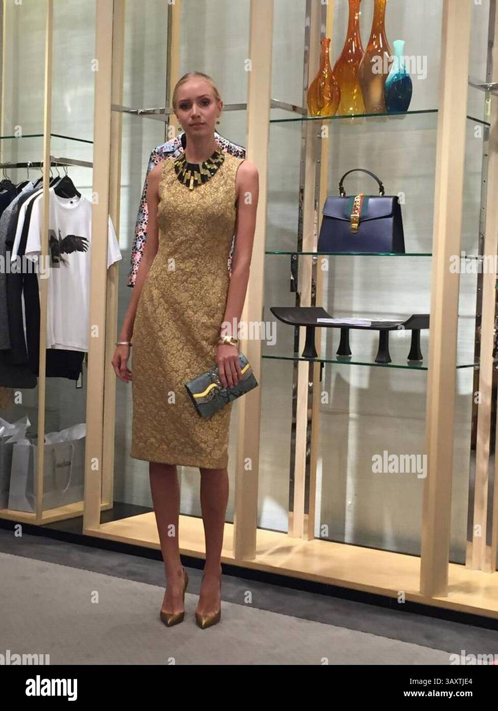Gold shiny metallic dress hi-res stock photography and images - Alamy
