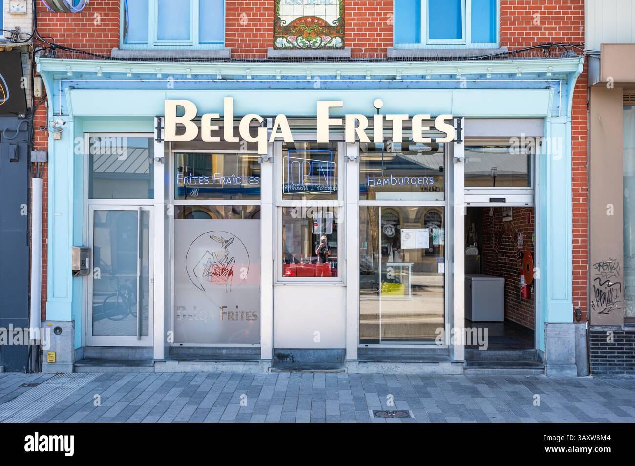 Facade of a traditional Belgian or French Fries fast food restaurant at the railway station of Mouscron, Hainaut, Belgium, 10 April 2025 Stock Photo